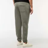 Pantalón de jogging verde de felpa cálida con bolsillos laterales y corte recto.