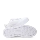 Championes urbanos Puma modelo Karmen II Idol, color blanco, con diseño de plataforma alta y suela dentada. Presentan el logo de la marca en el lateral y en la lengüeta.