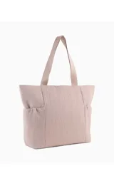 Bolso tipo shopper Puma Up de color negro, con asas de hombro y el logo de la marca en dorado en la parte frontal.