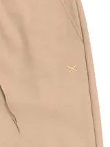 Pantalón babucha deportivo unisex azul, de tiro alto, con puños y cordones ajustables.