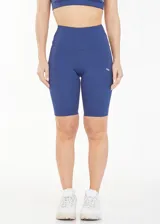 Calza biker deportiva de compresión color azul marino, de cintura alta con recortes y bolsillos laterales.