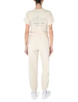 Pantalón deportivo de algodón color crema con logo estampado en azul marino.