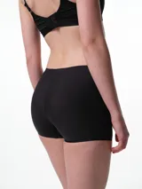 Culotte de microfibra color beige, de tiro medio y diseño sin costuras laterales, con refuerzo de algodón en el fundillo.