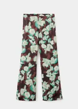 Pantalón largo estilo flare de tiro medio, con cintura elástica y forro interior, con estampado floral en tonos oscuros y verdosos.