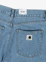 Pantalón de mezclilla Carhartt WIP modelo W' Jane Pant, de corte amplio y pierna ancha, talle alto y ligeramente acampanada. Confeccionado en denim orgánico Fairfield de 11 oz con lavado Blue Heavy Stone Wash.