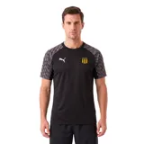 Camiseta de entrenamiento Puma, modelo Teamliga26, color negro con mangas en gris con patrón geométrico. Presenta el logo de la marca en blanco y escudo del Club Atlético Peñarol en el pecho.