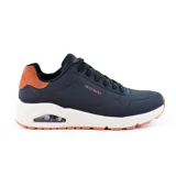 Championes Skechers Street Uno - Suited On Air, color negro con detalles en naranja. Capellada de durabuck en bajorrelieve con ribete de ante en el talón, plantilla Skechers Air-Cooled Memory Foam y media suela Skech-Air con cámara de aire visible.
