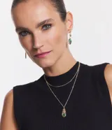 Conjunto de caravana y collar doble dorado con colgantes de gota en abalone.