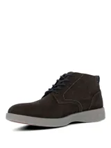 Botas de estilo casual Hush Puppies, confeccionadas en cuero gamuzado color gris oscuro. Presentan cierre de cordones, suela de poliuretano con tecnología Spinal para mayor amortiguación y estabilidad, y sistema de plantilla Dual Fit.