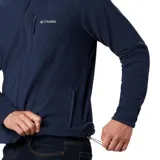 Campera polar de microfibra con cierre frontal completo, cuello alto, bolsillo en el pecho con cierre y bolsillos laterales con cierre. Diseño técnico de la marca Columbia.