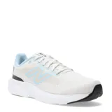 Championes de running New Balance modelo 413 para mujer, color blanco jaspeado con detalles en azul celeste en el forro interior y el logo 'N' lateral. Poseen una suela gruesa blanca y detalles en negro en la puntera y talón.