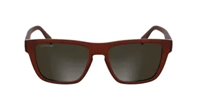 Lentes de sol Lacoste modelo 6058, con armazón de acetato en color marrón rojizo y cristales oscuros. Presentan un diseño rectangular clásico con el logo de la marca grabado en el cristal izquierdo.