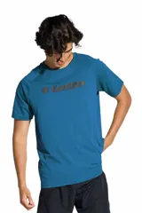 Remera deportiva Lotto de manga corta, color azul, con cuello redondo y el logo de la marca estampado en el pecho.