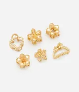 Kit de seis pinzas para el pelo tipo piraña, fabricadas en metal con acabado dorado. Incluye diversos diseños florales y geométricos con cierre de resorte.