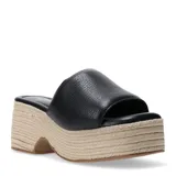 Zuecos de mujer marca Bottero, con capellada de cuero negro y plataforma de yute trenzado.