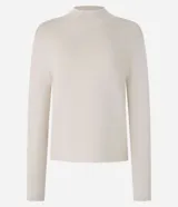 Blusa de punto de la marca Cortelle, con cuello alto y mangas largas. Confeccionada en una mezcla de viscosa y poliamida, presenta una textura suave y un diseño básico versátil.