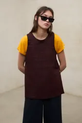 Top Sia de lino en color blanco, con cuello redondo y diseño sin mangas.