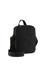 Morral Puma modelo Buzz Portable de color negro, con cierre de cremallera y correa ajustable para el hombro. Presenta el logo de la marca en relieve en la parte frontal.