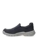 Zapatos tipo slip-on de la marca Caterpillar, confeccionados en lona de color azul marino con suela de goma gris de alta tracción. Presentan costuras reforzadas en la puntera y el logo de la marca en el lateral y la parte frontal de la suela.
