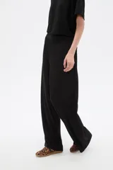 Pantalón ancho de tiro alto, color natural, confeccionado en poliéster con detalles de strass.