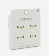 Set de cuatro anillos finos de acero inoxidable en color dorado. El kit incluye un anillo con diseño de nudo, uno de estilo trenzado, uno liso con forma orgánica y uno con acabado texturizado.