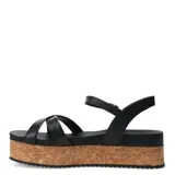 Sandalias de cuero color marrón caramelo con plataforma de corcho, tiras cruzadas en el empeine y cierre con hebilla metálica en el tobillo.