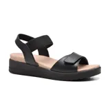 Sandalias de cuero azul marino con plataforma baja color crema. Tiras anchas con ajuste de velcro y elástico.