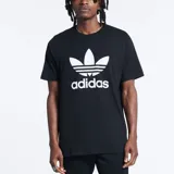 Remera negra de algodón con logo Adidas Trefoil estampado en blanco en el frente.