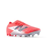 Championes de fútbol New Balance Furon Elite V8, color coral con detalles en plateado y azul marino.