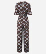 Mono largo de viscosa con estampado gráfico de soles, escote en V profundo, mangas cortas amplias y aberturas laterales en la cintura.