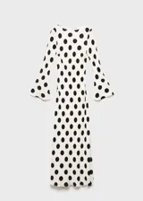 Vestido largo color crema con estampado de lunares negros, de corte ajustado, cuello redondo y mangas largas acampanadas.
