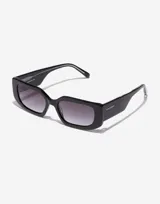 Lentes de sol Hawkers unisex de acetato negro con lentes rectangulares degradadas de gris oscuro a transparente.