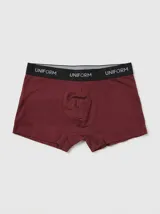 Boxer clásico de algodón en color bordó con cintura elástica negra personalizada con la inscripción "UNIFORM" en color gris.