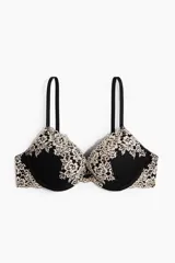 Soutien push-up negro con detalles de encaje beige en las copas y los laterales, tirantes ajustables y aros.