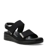 Sandalias de plataforma baja para mujer, color negro, con tiras anchas cruzadas y detalles metálicos plateados. Cierre ajustable con velcro.