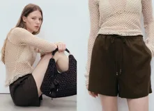 Short de corte recto confeccionado en mezcla de lino y viscosa, color verde militar. Cuenta con cintura elástica con cordón ajustable y forro interior.