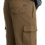 Pantalón cargo Volcom modelo ABG Billow Tapered EW, color verde militar, de corte holgado y tiro bajo, con bolsillos laterales en las piernas.