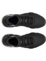 Championes de entrenamiento Under Armour modelo Halo Trainer, color negro. Presentan un diseño técnico con amortiguación HOVR reactiva, parte superior con perforaciones para ventilación y contrafuerte externo en el talón para mayor estabilidad.