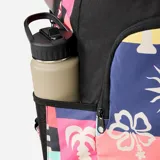 Mochila Rip Curl modelo Ozone 2.0 con capacidad de 30 litros. Presenta un diseño multicolor con estampado de motivos tropicales como flores de hibisco, soles y palmeras en estilo patchwork sobre una base negra. Cuenta con un compartimento principal amplio, un bolsillo frontal con cierre, bolsillos laterales y correas ajustables acolchadas.