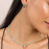 Aros de plata 925 con piedra rectangular de ónix paraiba.