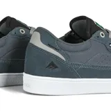 Championes de skate Emerica modelo Gamma, color negro con detalles en verde en la lengüeta. Presentan una construcción resistente con paneles de gamuza y material sintético, suela de goma vulcanizada y logo de la marca en el lateral y lengüeta.