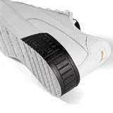 Championes urbanos Puma modelo Carina 2.0, color negro con la icónica franja lateral en blanco. Presentan una suela de plataforma de goma blanca con diseño texturizado y cierre mediante cordones.