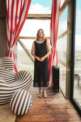 Vestido largo tejido en hilo de algodón con calado, color negro con detalles en celeste y naranja.