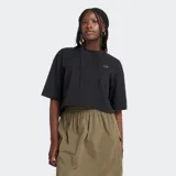 Remera negra de corte holgado con logo de New Balance en el pecho.