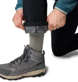 Pantalon de senderismo color negro, con cintura parcialmente elástica, cinturón integrado, múltiples bolsillos funcionales y refuerzo en la entrepierna.