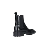Botas Chelsea Saint Laurent Joe de cuero negro, con paneles laterales elásticos, detalle de costuras en el empeine y suela gruesa track con tacón bajo.