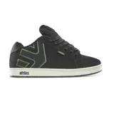 Championes Etnies Fader negros con logo verde en el lateral y suela blanca.