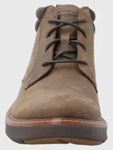 Bota de cuero marrón con ajuste de cordones, cuello acolchado de tejido técnico y suela tecnológica Spinal Flex de alta amortiguación.