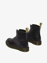 Botas Dr. Martens modelo 1460, de 8 ojetes, color negro, fabricadas con material sintético vegano Felix Rub Off.