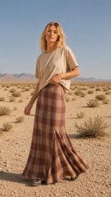 Falda larga de tiro alto con estampa a cuadros escoceses, corte amplio de silueta evasé, cierre invisible lateral y confeccionada en tweed.